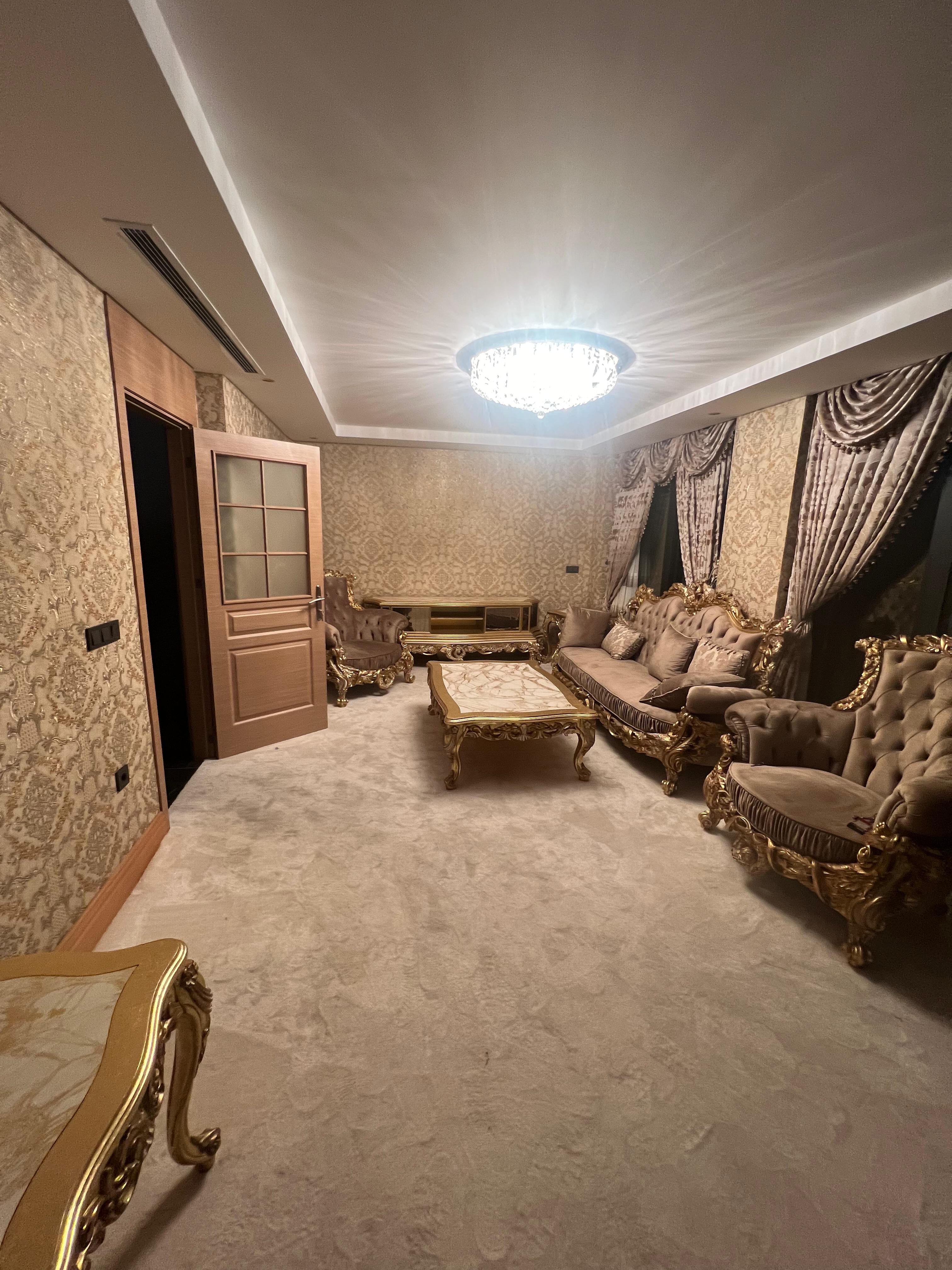 Villa E formal salon with gold-detailed furniture in Istanbul luxury villa